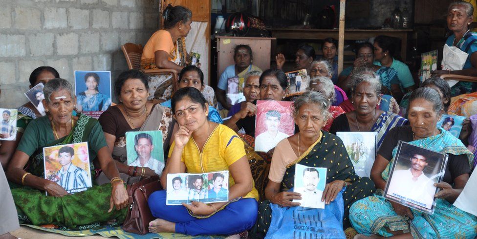 Tamils with photos of their missing relatives