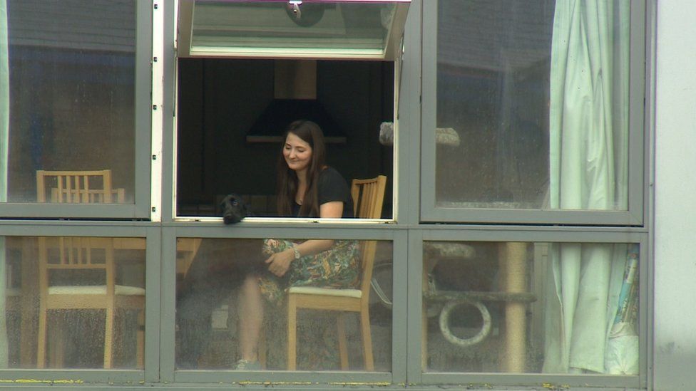 Zoe Bartley at her flat window