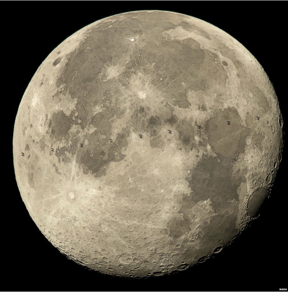 Composite of multiple images combined to produce this image.) In this handout provided by the National Aeronautics and Space Administration (NASA), This composite image made from nine frames shows the International Space Station, with a crew of six onboard, as it transits the moon at roughly five miles per second on 2 August 2015 in Woodford, VA
