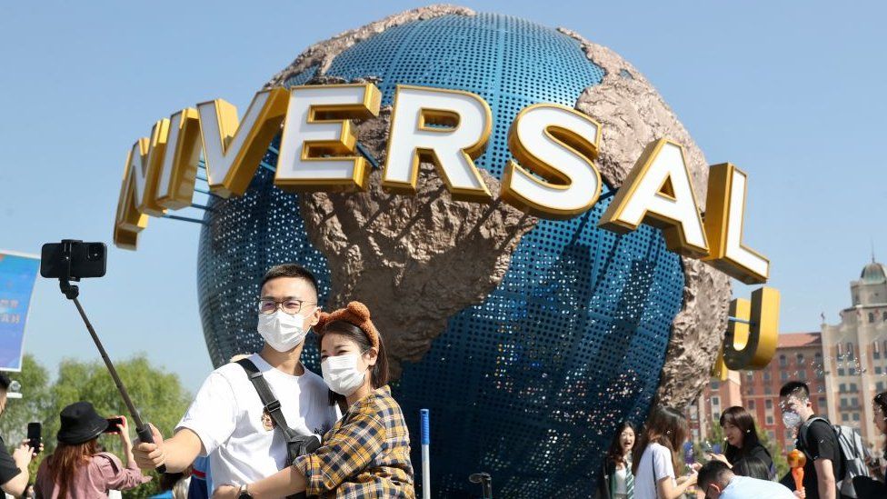 People taking a selfie while visiting the Universal Beijing Resort.