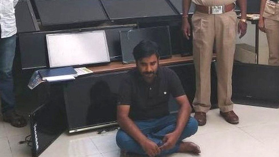 Bangalore police with Vasudev Nanaiah and some of the television sets he had stolen