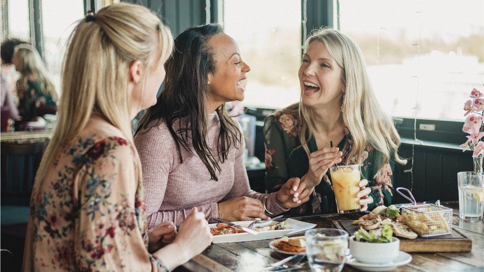 Friends eating lunch (stock image)