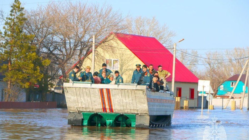 Russians being evacuated following a dam breach