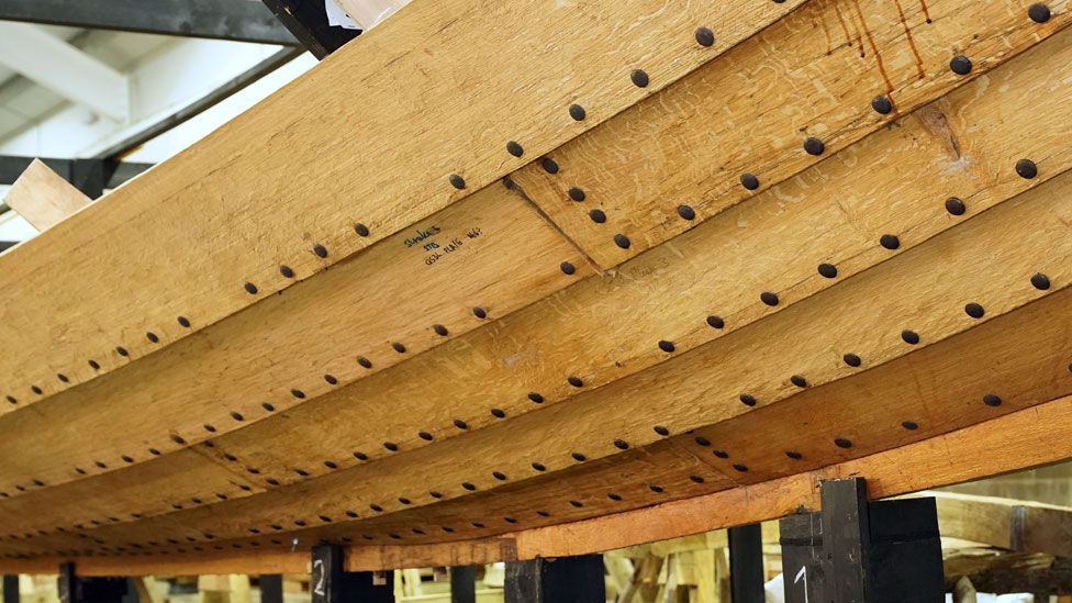 A close-up of attached planks on the side of a replica Anglo-Saxon ship, Woodbridge