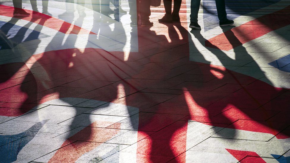 People's shadows over Union flag