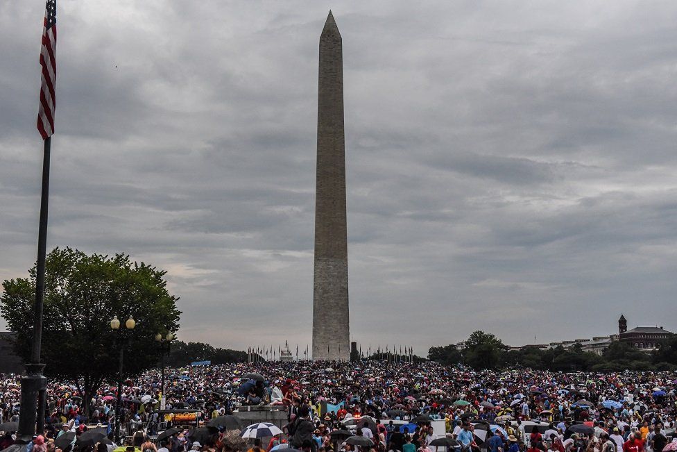 People gather on the National Mall during President Donald Trump's speech during Fourth of July festivities on 4 July, 2019