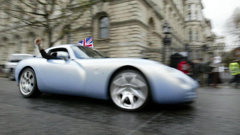 A man driving a TVR Tuscon