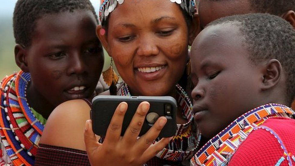 Ethiopian woman looking at phone