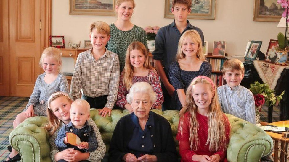 The late Queen with her grandchildren and great-grandchildren