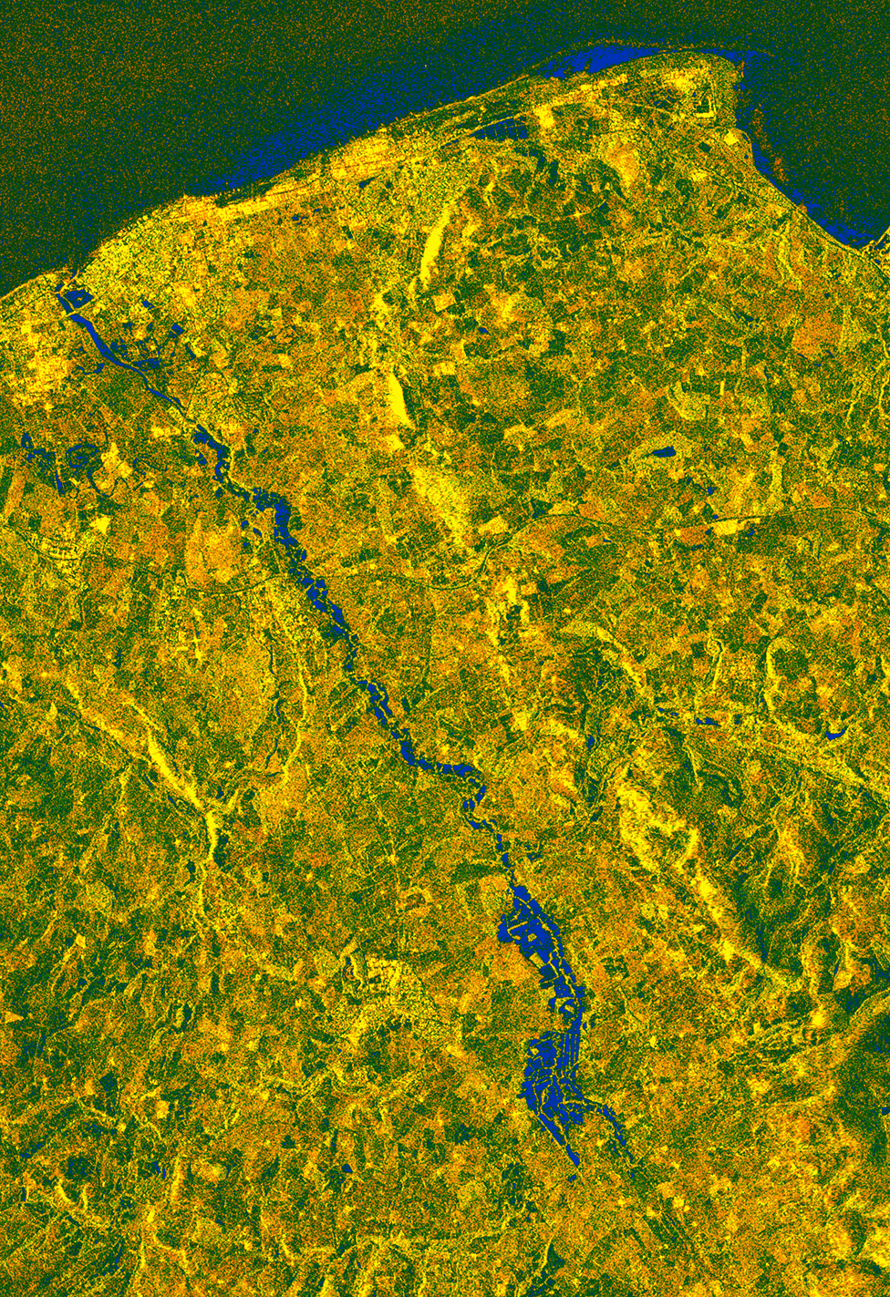Flood waters (dark blue) from the River Clwyd in North Wales are imaged by the EU's Sentinel-1 radar satellite on Thursday