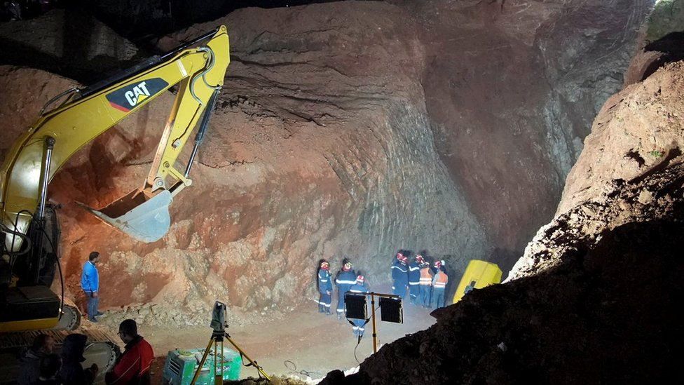 Rescuers work to reach a five-year-old boy trapped in a well in the northern hill town of Chefchaouen, Morocco