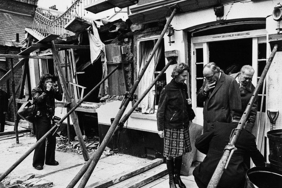 Home Secretary Roy Jenkins and Commander Bob Huntley of the Scotland Yard bomb squad inspect the site of the Horse and Groom pub in Guildford