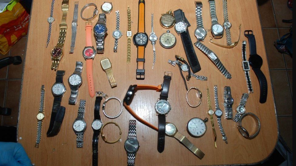 A series of stolen watches on a brown table