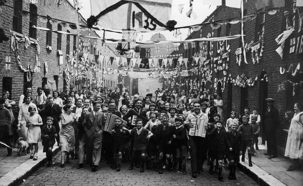 5th May 1935: Residents of Dudley Street, Paddington, London, at the start of their jubilee festivities in honour of King George V.