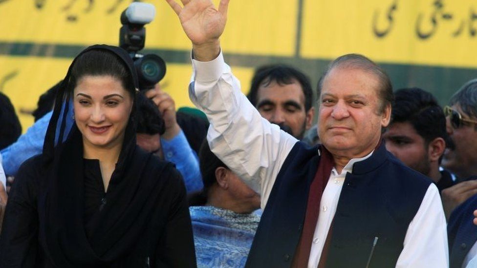 Nawaz Sharif (R), former Prime Minister and leader of Pakistan Muslim League, gestures to supporters as his daughter Maryam Nawaz looks on during party"s workers convention in Islamabad, Pakistan 4 June 2018.