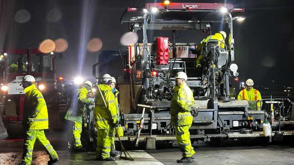 Engineers astatine  Stansted Airport relaying asphalt