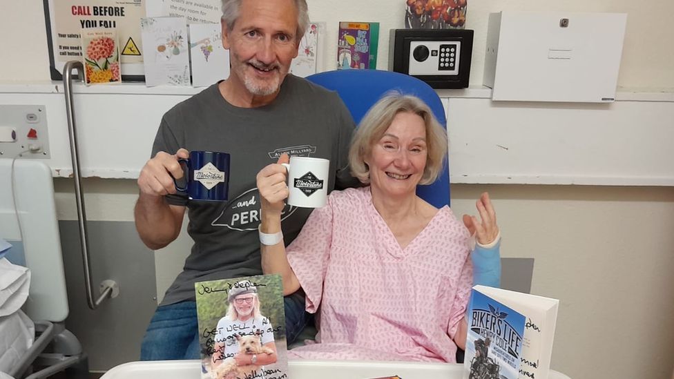 Jennifer Baker and her partner Stephen Sharman holding mugs