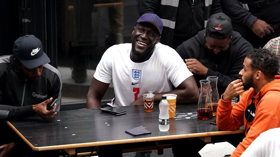England fan and rapper Stormzy watches the match at Boxpark Wembley in north London.