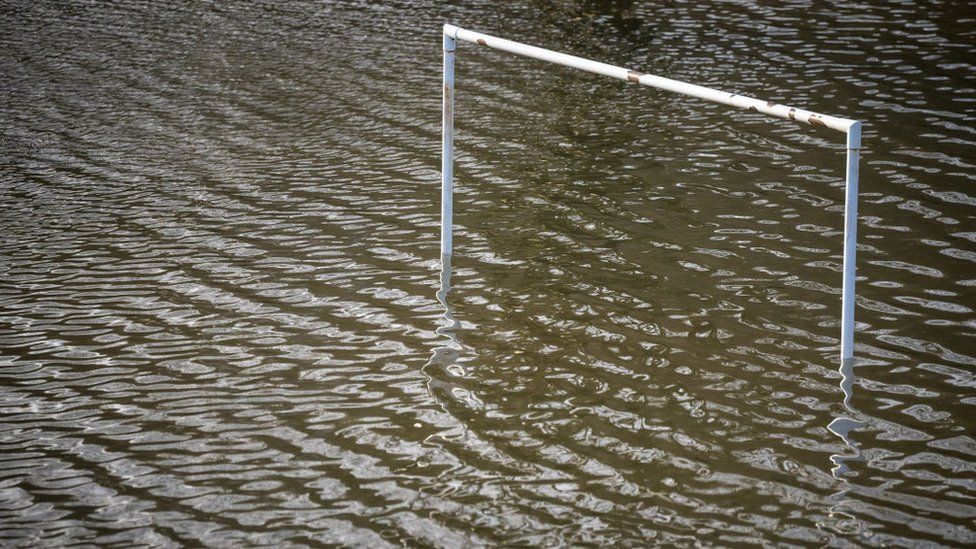 Goalposts underwater on a flooded football pitch on January 12, 2022, in Taff’s Well, Wales