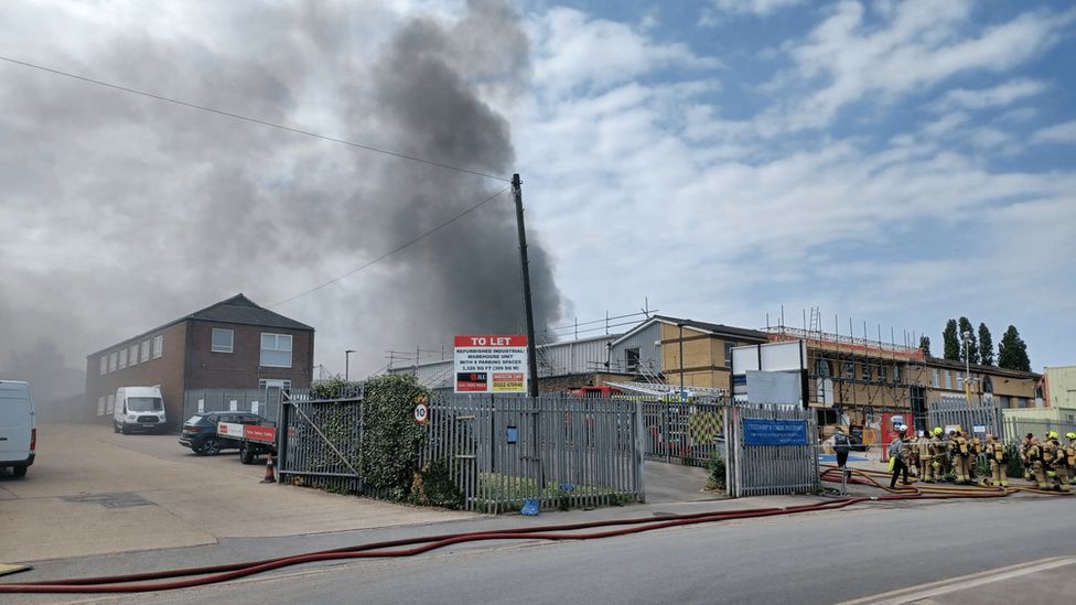 Smoke rising from the scrapyard