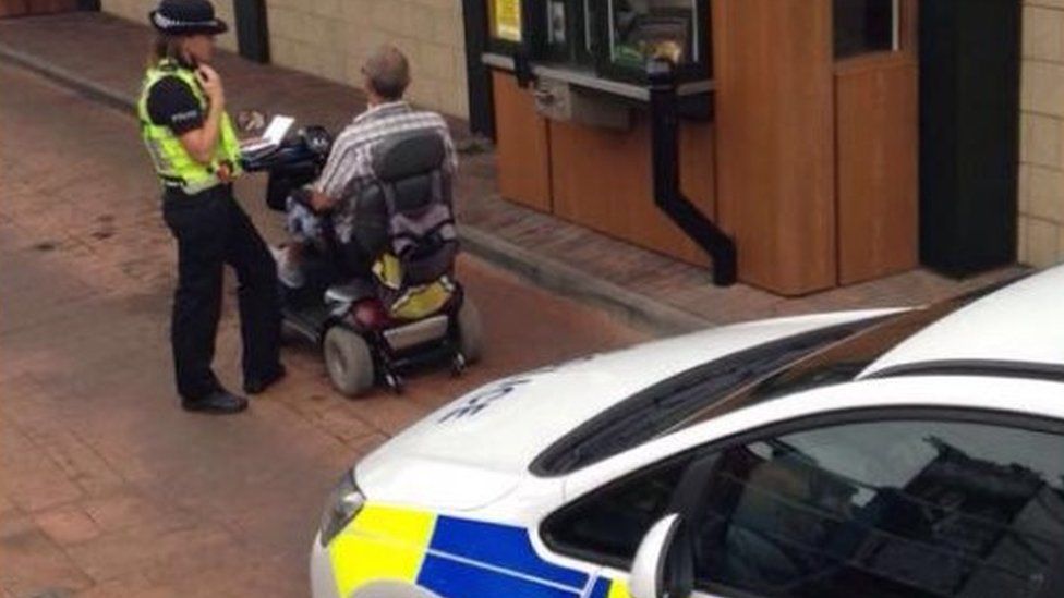 Man on mobility scooter