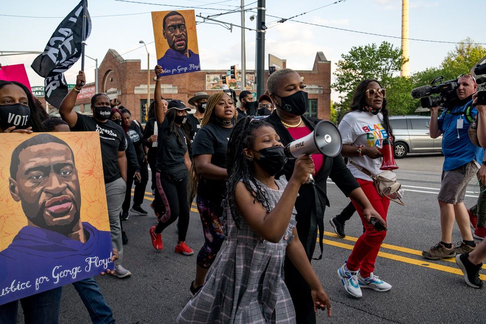 People march through the streets after the verdict was announced for Derek Chauvin on 20 April 2021 in Atlanta