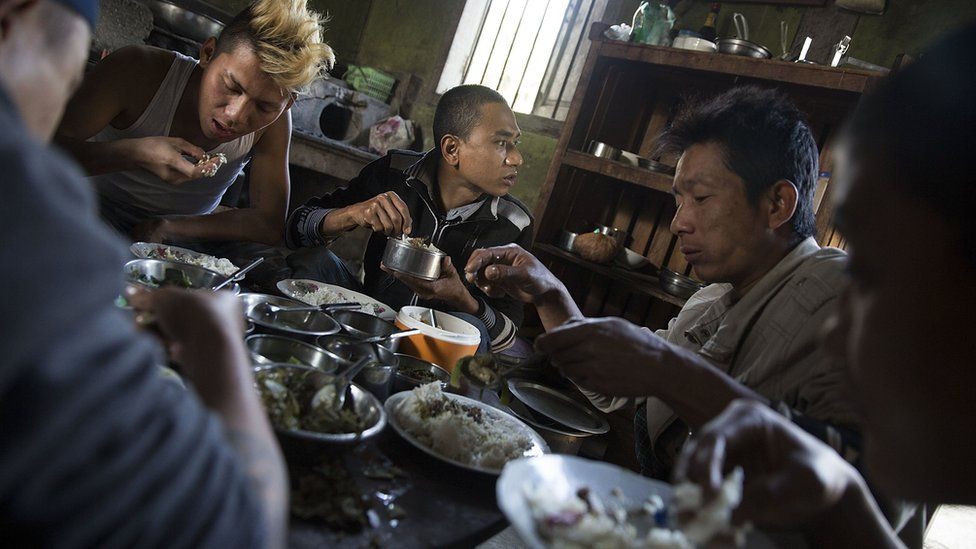 Pat Jasan members and detainees share a meal on 26 January 2016 in Myitkyina, Kachin state.
