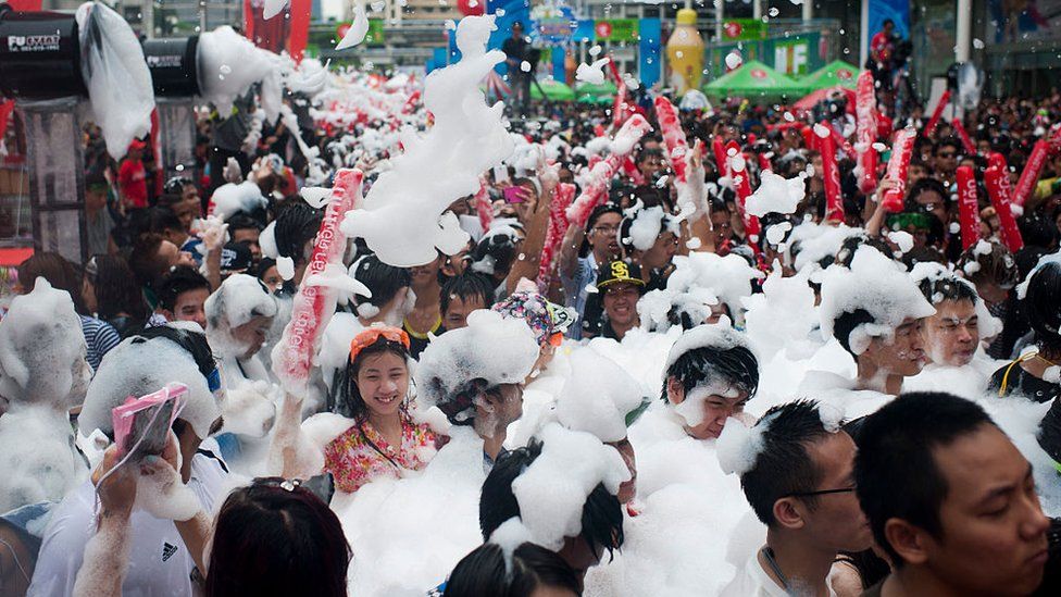 Revellers take part in a water fight during the Songkran water festival in Silom road on April 13, 2015 in Bangkok, Thailand.