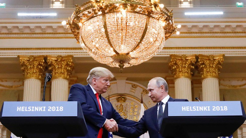 U.S. President Donald Trump and Russia"s President Vladimir Putin shake hands during a joint news conference after their meeting in Helsinki, Finland, July 16, 2018