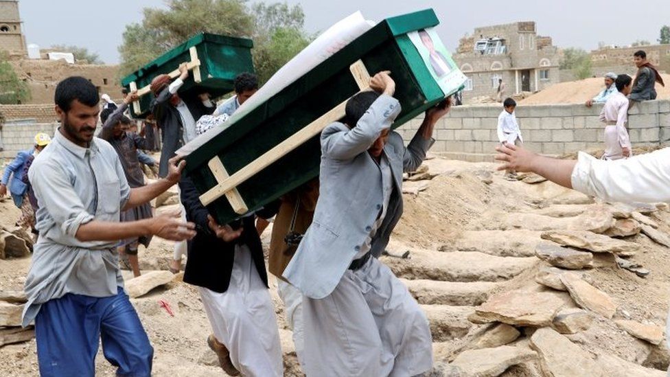 Mourners carry coffins during a funeral of people, mainly children, killed in a Saudi-led coalition air strike on a bus in northern Yemen, in Saada, Yemen on 13 August 2018.