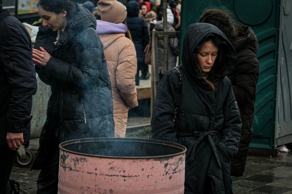 Outside Lviv station, fire barrels were lit during the nights to keep the crowds warm.