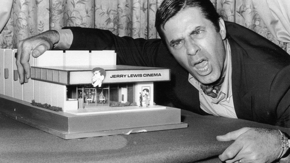 22nd April 1971: American comedian and film star Jerry Lewis with a model of the "Jerry Lewis Cinema".