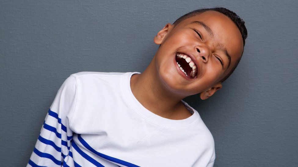 Boy laughing.