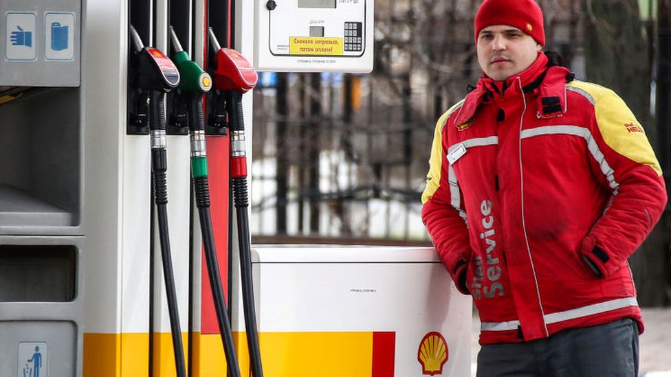 Worker at Shell petrol station in Russia