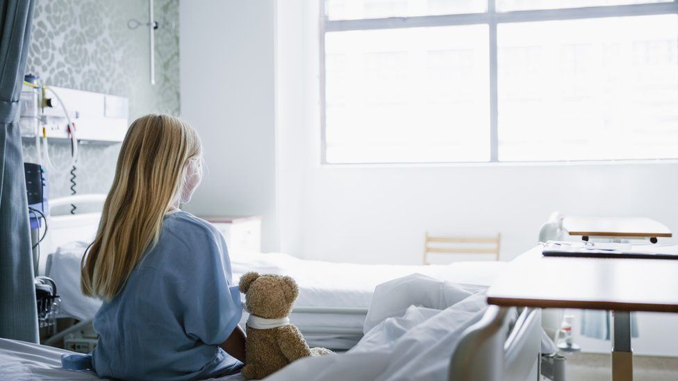 Child in a hospital bed (generic image)