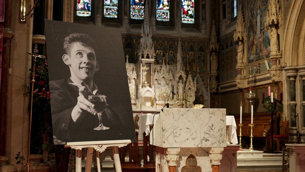 A picture of late Irish singer Shane MacGowan is displayed on the day of his funeral procession, in Tipperary