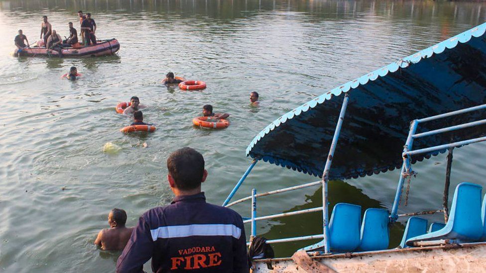 Members of Vadodara Fire and Emergency Services conduct search and rescue after a boat capsized at Harni Lake in Vadodara on January 18, 2024. At least 10 people, including nine children, drowned when a boat capsized on January 18 in western India, officials said, with a search on to find more of the missing. (Photo by AFP) (Photo by -/AFP via Getty Images)