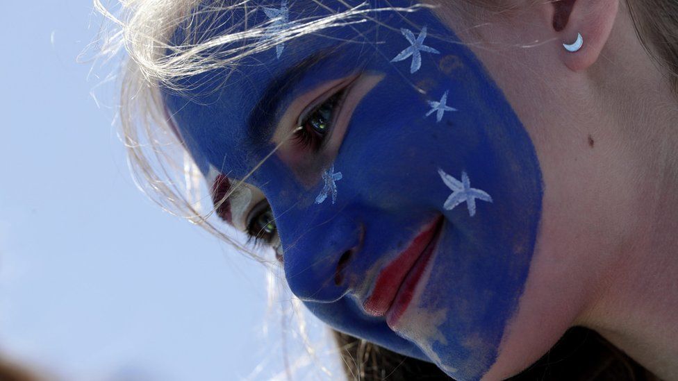 Girl with face painted in Australian flag