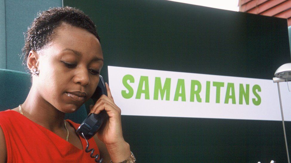 A Samaritans councillor taking a phone call from someone needing emotional support