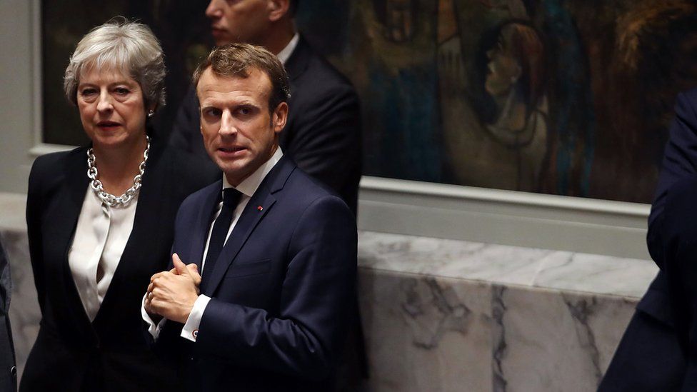 French President Emmanuel Macron waits with British Prime Minister Theresa May for the arrival of President Donald Trump who is chairing a United Nations Security Council meeting on September 26, 2018 in New York City