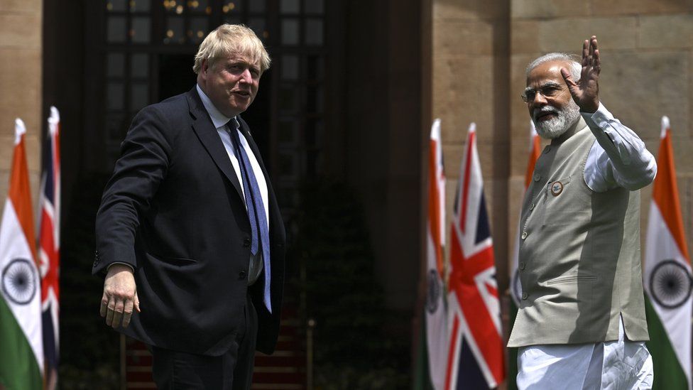 British Prime Minister Boris Johnson seen with Indian Prime Minister Narendra Modi during a trip to India in April 2022