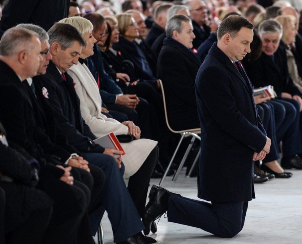 President of Poland Andrzej Duda (right) kneels as he prays with his wife Agata Kornhauser-Duda (4-left), Polish Senate Speaker Stanislaw Karczewski (2-left) and Polish Sejm Speaker Marek Kuchcinski (3-left) in the Temple of Divine Providence as part of the Independence Day celebrations in Warsaw, Poland, on 11 November 2016.