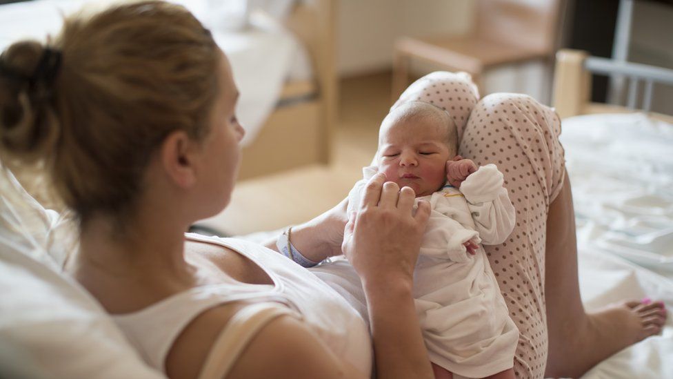 Mother with her newborn baby in the hospital