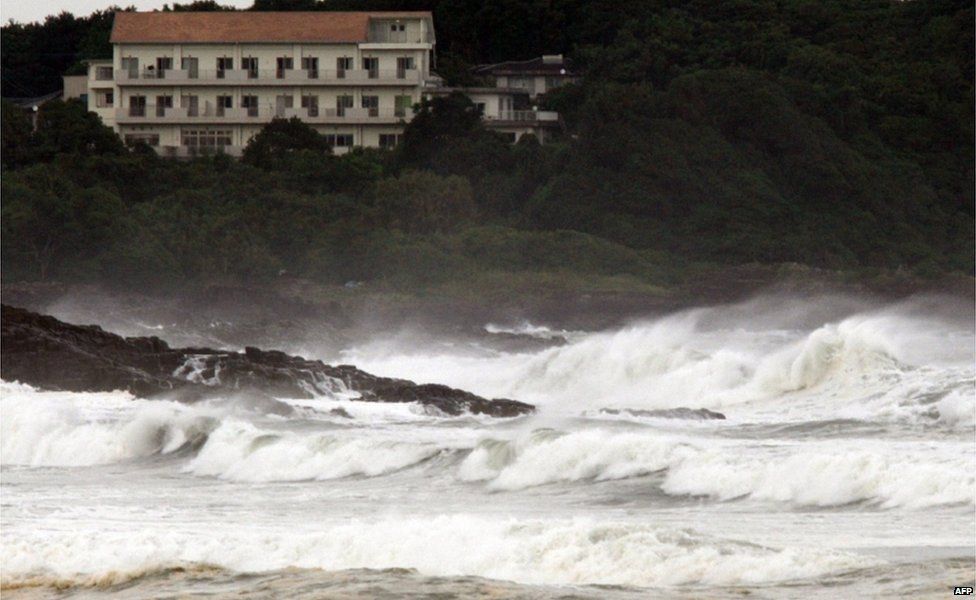 High waves crash into the coast at Hyuga in Miyazaki prefecture, Japan"s southern island of Kyushu on 16 July 2015.