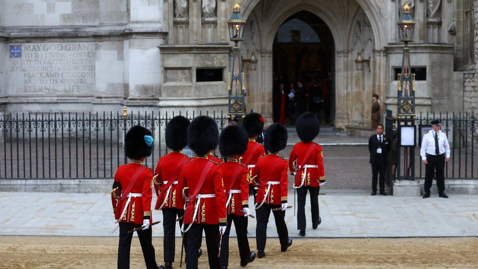 Soldiers in ceremonial uniform walk into Westminster Abbey, on the day of the state funeral and burial of Britain's Queen Elizabeth, in London, Britain, September 19, 2022. REUTERS/Hannah Mckay/Pool