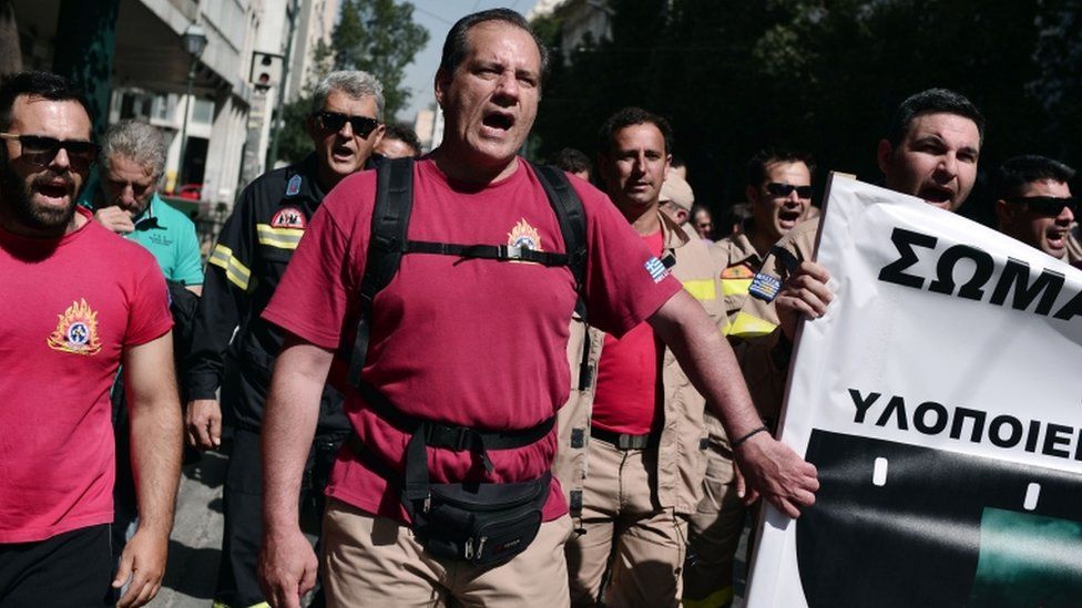 Greek firefighters march in central Athens during a protest against austerity measures