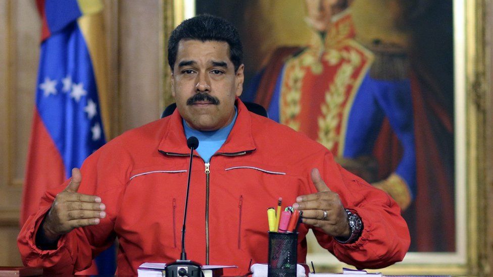 Handout picture released by the Venezuelan presidency press office showing Venezuelan President Nicolas Maduro during a press conference after knowing the first result in the legislative election, in Caracas on December 7, 2015.