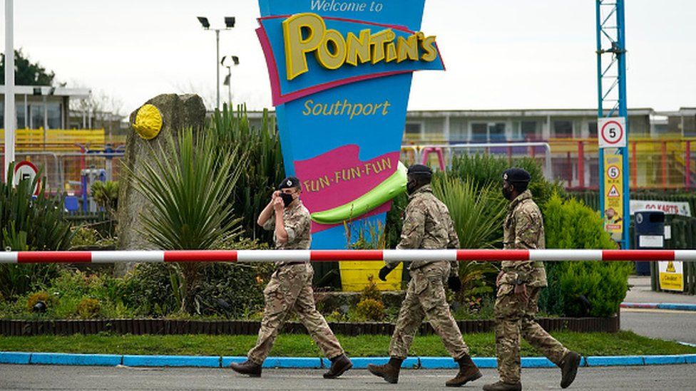 Members of the military arrive at Pontins by Ainsdale Beach in Southport