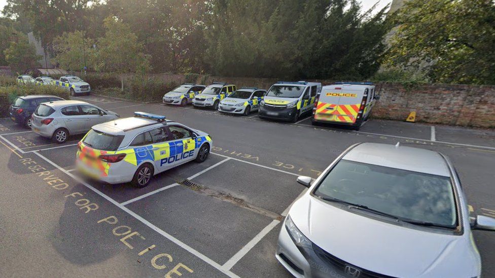 Salisbury car park with police parked