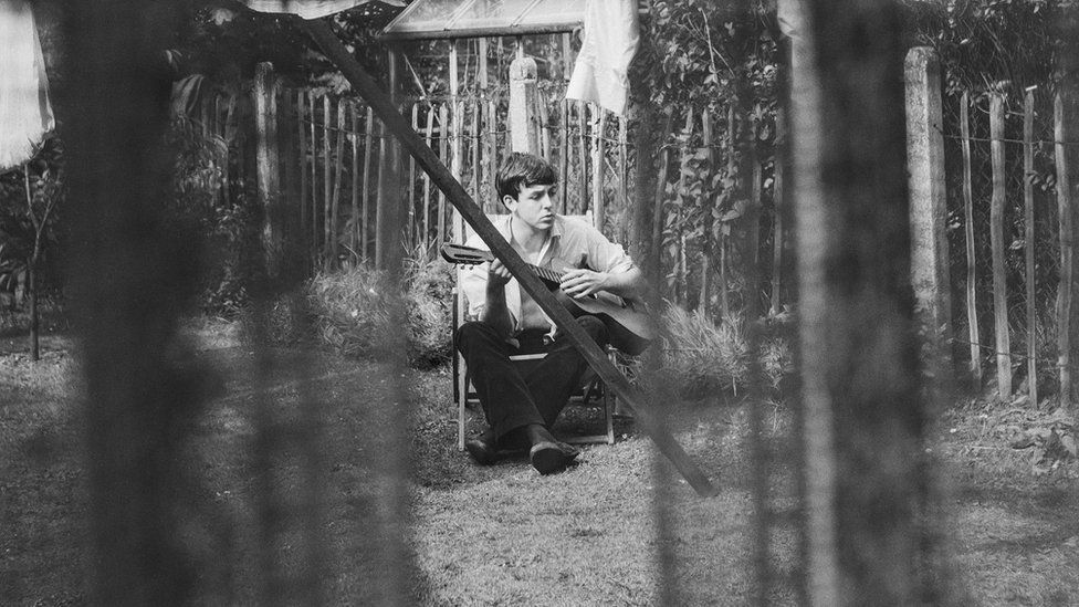Sir Paul McCartney playing at 20 Forthlin Road